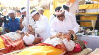 Jaya Negara Ngayah Nyangging pada Metatah Massal Desa Adat Panjer